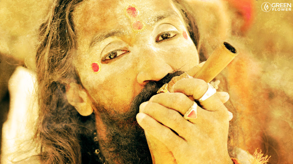 man smoking a chillum in ritual